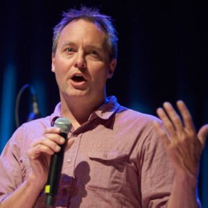 Kris holding a microphone